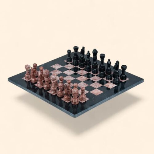 Black and Rose Pink Marble Chess Set on wooden table Black and Rose Pink Marble Chess Set